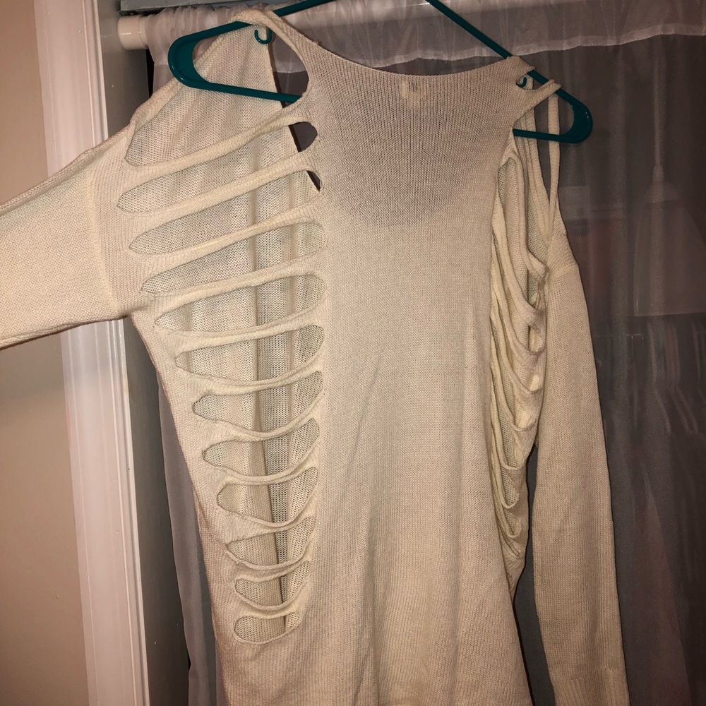 White sweater with cuts in back